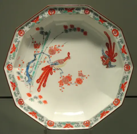 A late seventeenth-century decagonal Arita porcelain plate painted with a bird on a branch