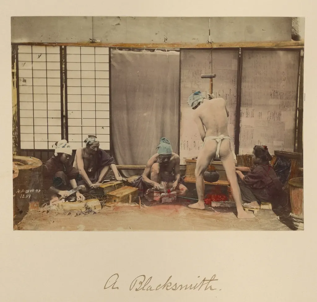 A nineteenth-century photograph of Japanese blacksmiths at work in a forge