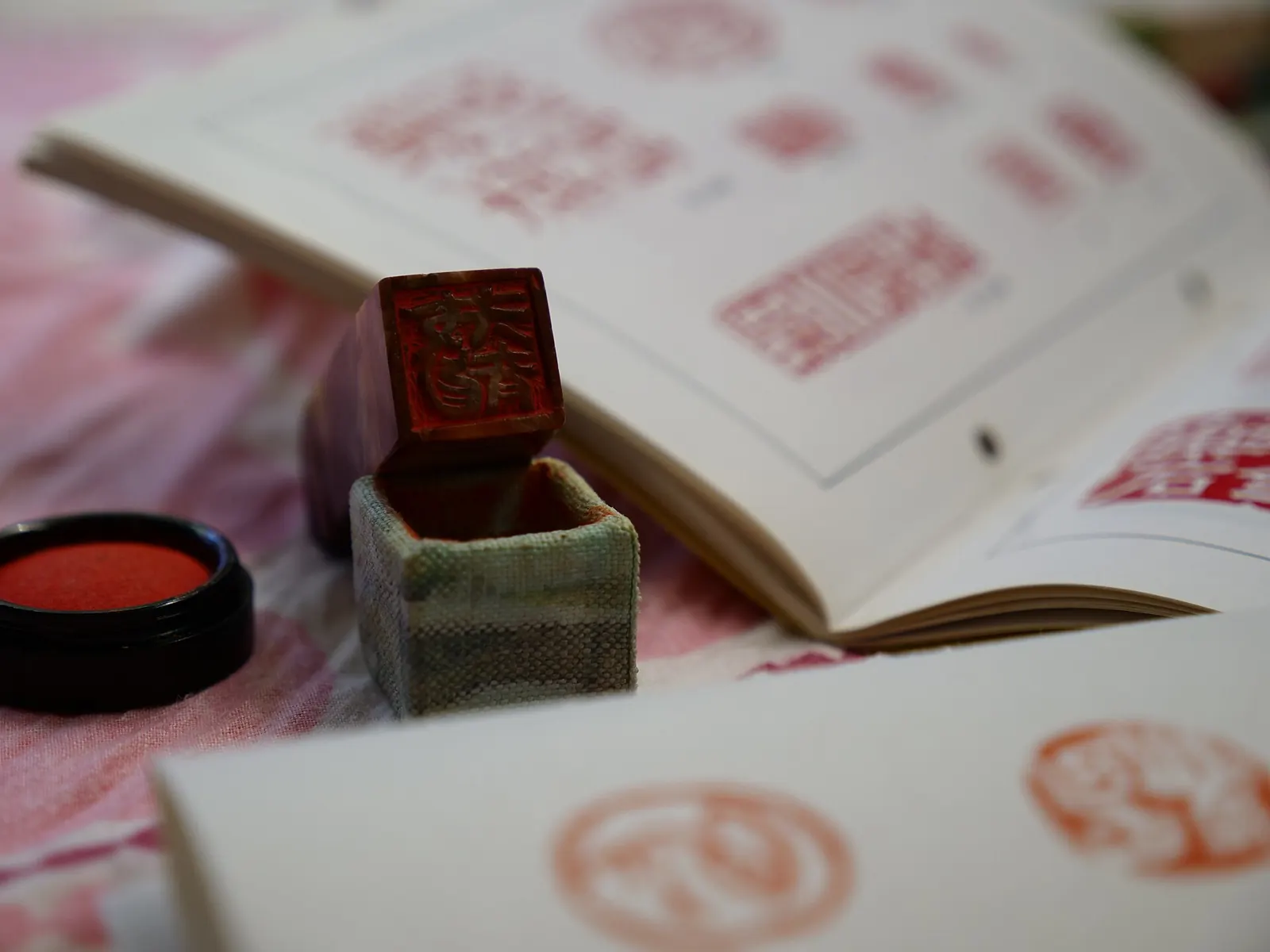 A Japanese hanko seal with red ink stamped on paper