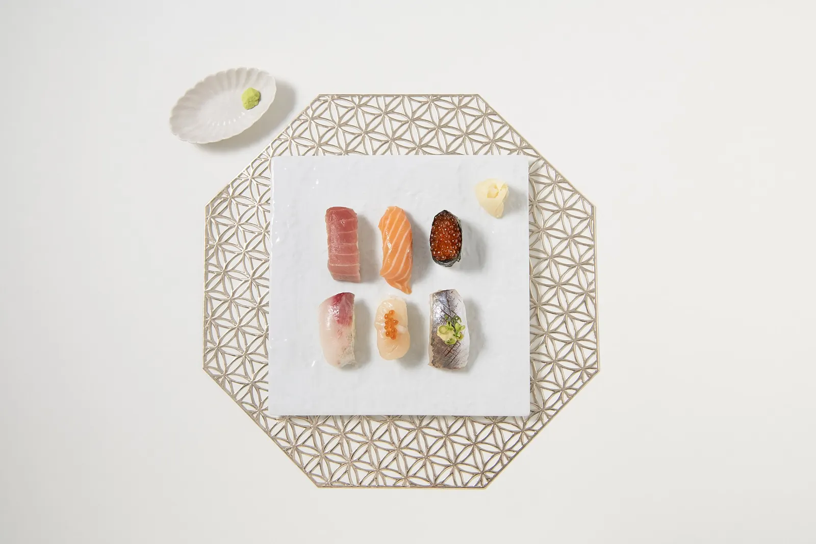 A Japanese ceramic serving plate with sushi, photographed from above
