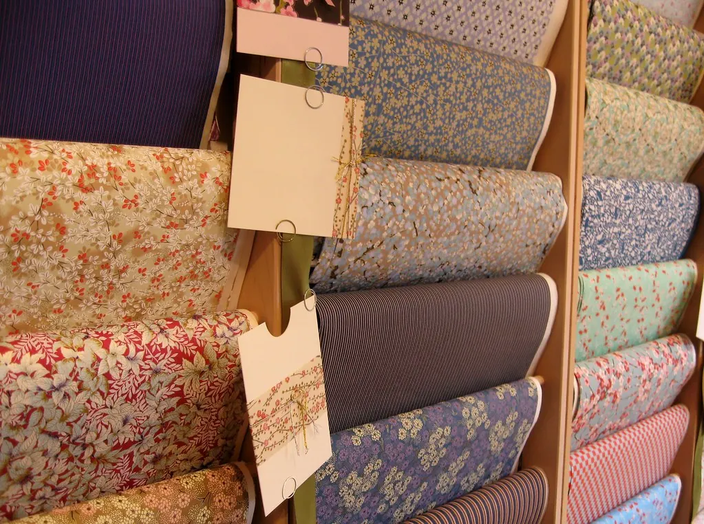 Rolls of patterned Japanese washi paper on a shop shelf